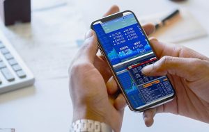 Businessman checking stock market online